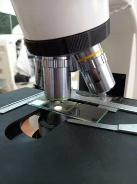 Photo of light microscope objectives of different magnifications. Stock Photos