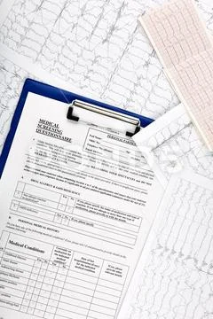 Photo of many MRI cardiograms and medical questionnaire Stock Photos