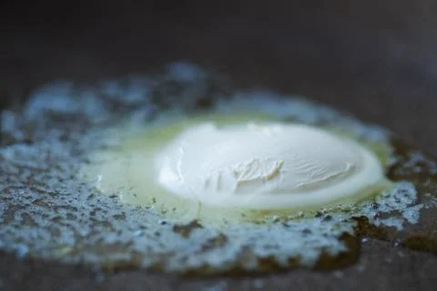 A photo of melting butter in a pan Stock Photos