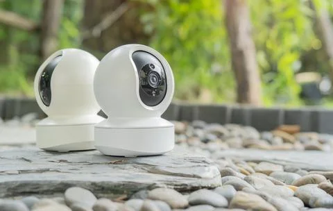 Photo of a modern security camera on a table for home security and surveillan Stock Photos