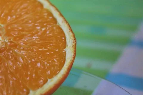 Photo of an orange on a table Stock Photos