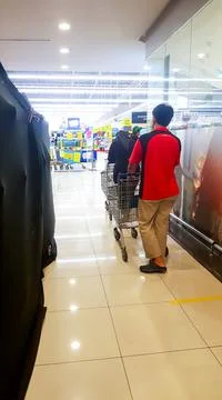A photo of people queue inside Tesco Bandar Puteri shopping mall. Stock Photos