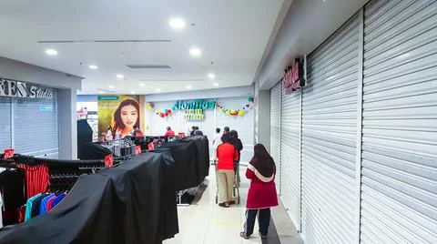A photo of people queue inside Tesco Bandar Puteri shopping mall. Stock Photos