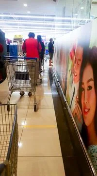 A photo of people queue inside Tesco Bandar Puteri shopping mall. Stock Photos