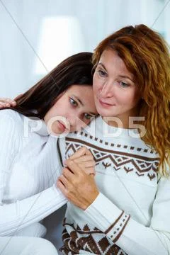 Photo of pretty woman embracing her daughter in trouble Stock Photos