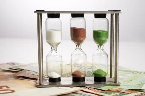Photo of Sand Timer Banknotes Stock-Fotos