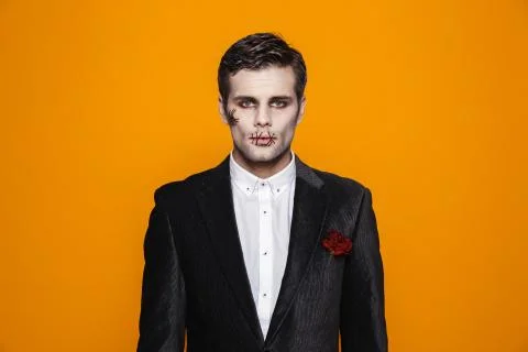 Photo of scary zombie man on halloween wearing classical suit and creepy make Stock Photos