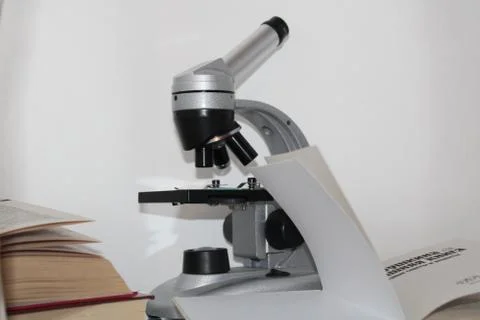 The photo shows a microscope. Stock Photos