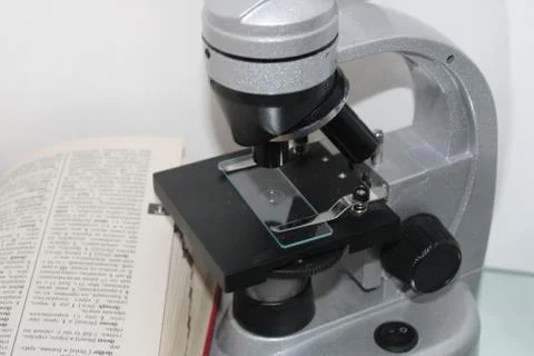 The photo shows a microscope. Stock Photos