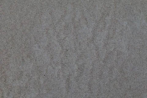 The photo shows sand with a pattern. 스톡 사진