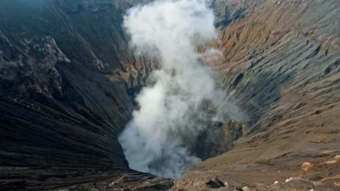 Photo of smoke volcano crater on Java island Stock Photos