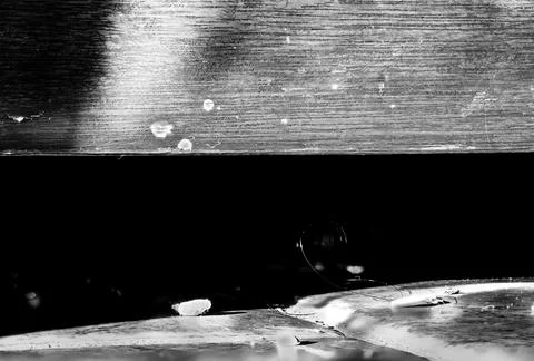 Photo-stack macro of dirt and dust under a kitchen cabinet on tile floor. Stock Photos