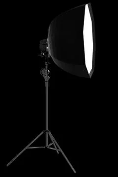 Photo studio lighting stands with flash and octobox isolated on the black. Stock Illustration