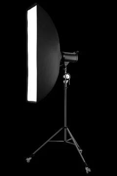 Photo studio lighting stands with flash and softbox isolated on the black. Stock Illustration