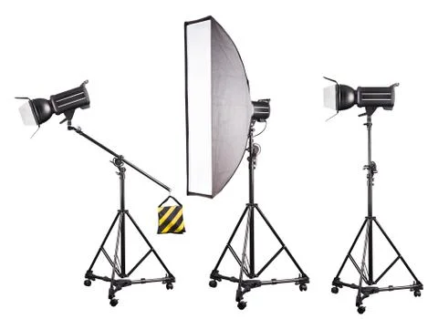 Photo studio lighting stands with flash and softbox isolated on the white. Stock Photos
