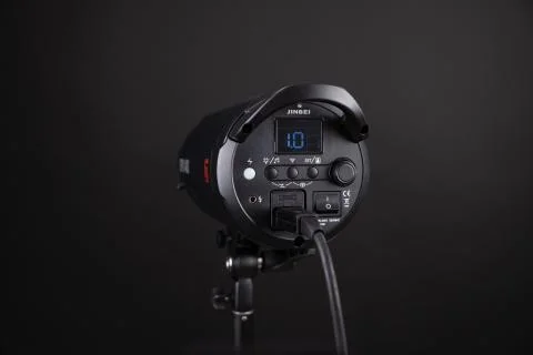 Photo studio strobe light flash bulb. Close up view of professional studio Stock Photos