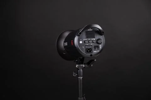 Photo studio strobe light flash bulb. Close up view of professional studio Stock Photos