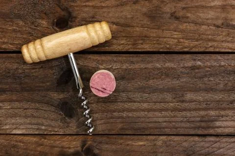 Photo of wine corkscrew and cork on dark background 写真素材