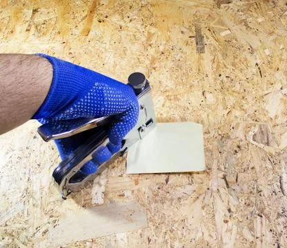 Photo of a worker hand with stapler. Foto stock