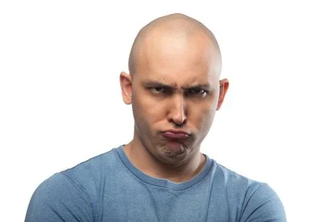 Photo of young bald grumpy man in blue tee shirt Stock Photos