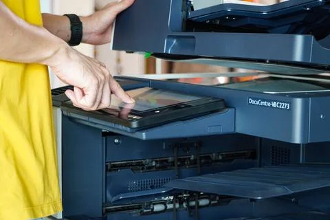 Photocopier printer,Men press the button of the copier. Stock Photos