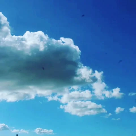 Photograph of clouds in blue sky in the style of time laps Stock Footage 144677360
