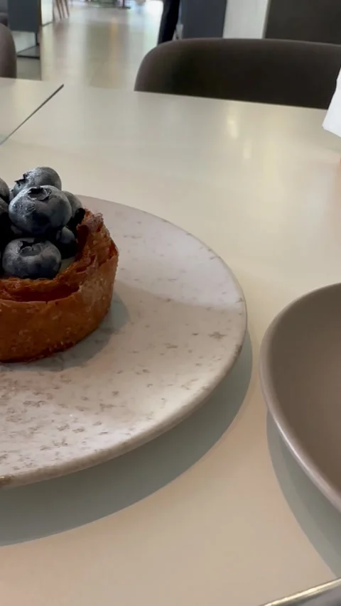 A photograph of a cozy café table featuring aromatic latte Stock Footage 287489891