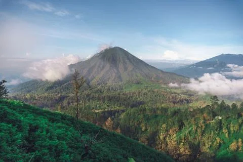Photograph of high volcano with clouds on Java island 스톡 사진