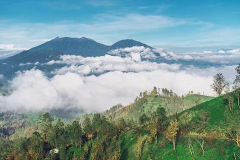 Photograph of high volcano with clouds on Java island Stock Photos