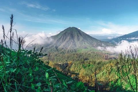 Photograph of high volcano with clouds on Java island Stock Photos