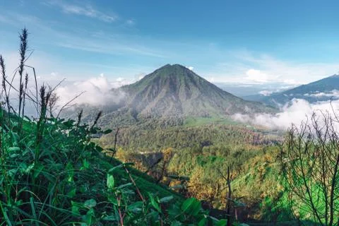 Photograph of high volcano with clouds on Java island Stock Photos
