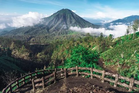 Photograph of high volcano with clouds on Java island Stock Photos