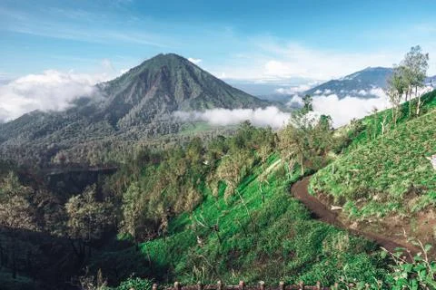 Photograph of high volcano with clouds on Java island Stock Photos