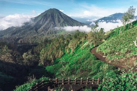 Photograph of high volcano with clouds on Java island Stock Photos