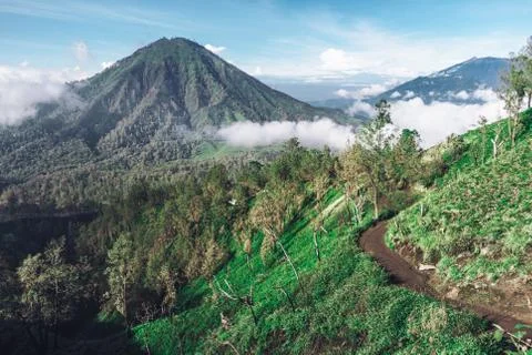 Photograph of high volcano with clouds on Java island Stock Photos