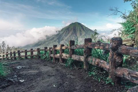 Photograph of high volcano with clouds on Java island Stock Photos