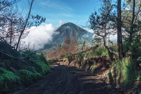 Photograph of high volcano with clouds on Java island Stock Photos