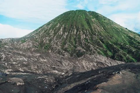 Photograph of high volcano with clouds on Java island Stock Photos