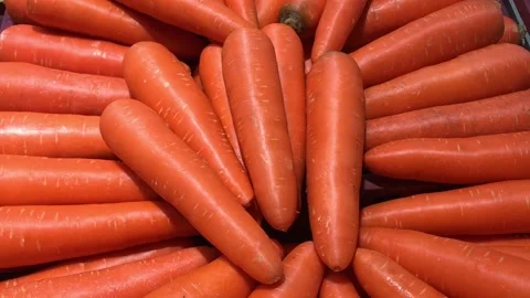 A photograph of an orange carrot full-frame and taken up close. Stock Footage 147384353