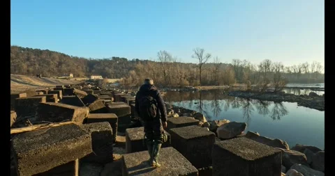 Photographer in action on a dam Stock Footage 313809363