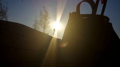 Photographer and model are preparing for a photo shoot, turning over lenses 스톡 동영상 101990182