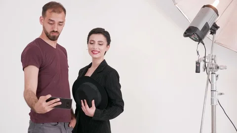 Photographer and model having fun at the end of the shoot Stock Footage 108380406