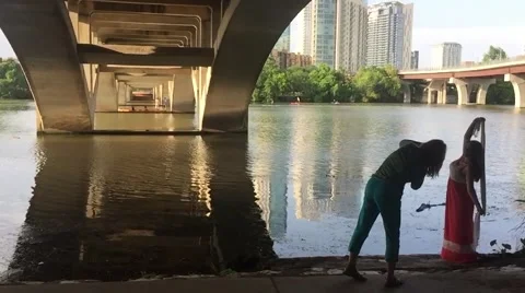 Photographer and Model under bridge with Skyline in background Stock Footage 50227948