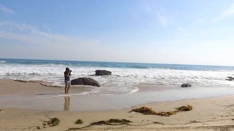 Photographer on the Beach Stock Footage 106551209