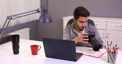 Photographer with camera and laptop computer Stock Footage 107767044