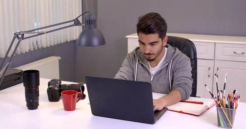 Photographer with camera and laptop computer Stock Footage 107767327