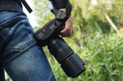 A photographer with the camera. Stock Photos