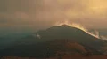The photographer with the camera standing on the mountain 4k or 4k+ Resolution