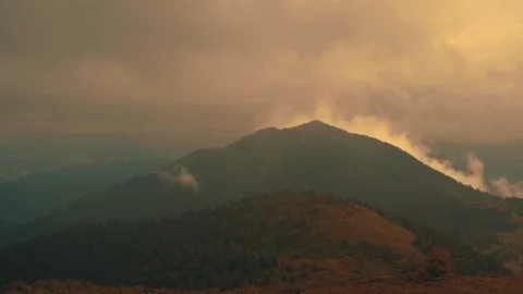 The photographer with the camera standing on the mountain Video stock 116062592