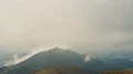 The photographer a the camera standing on the mountain 4k or 4k+ Resolution
